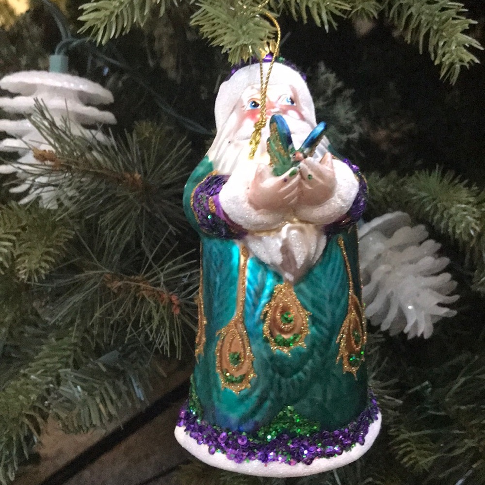 Frontgate Santa peacock holding a butterfly